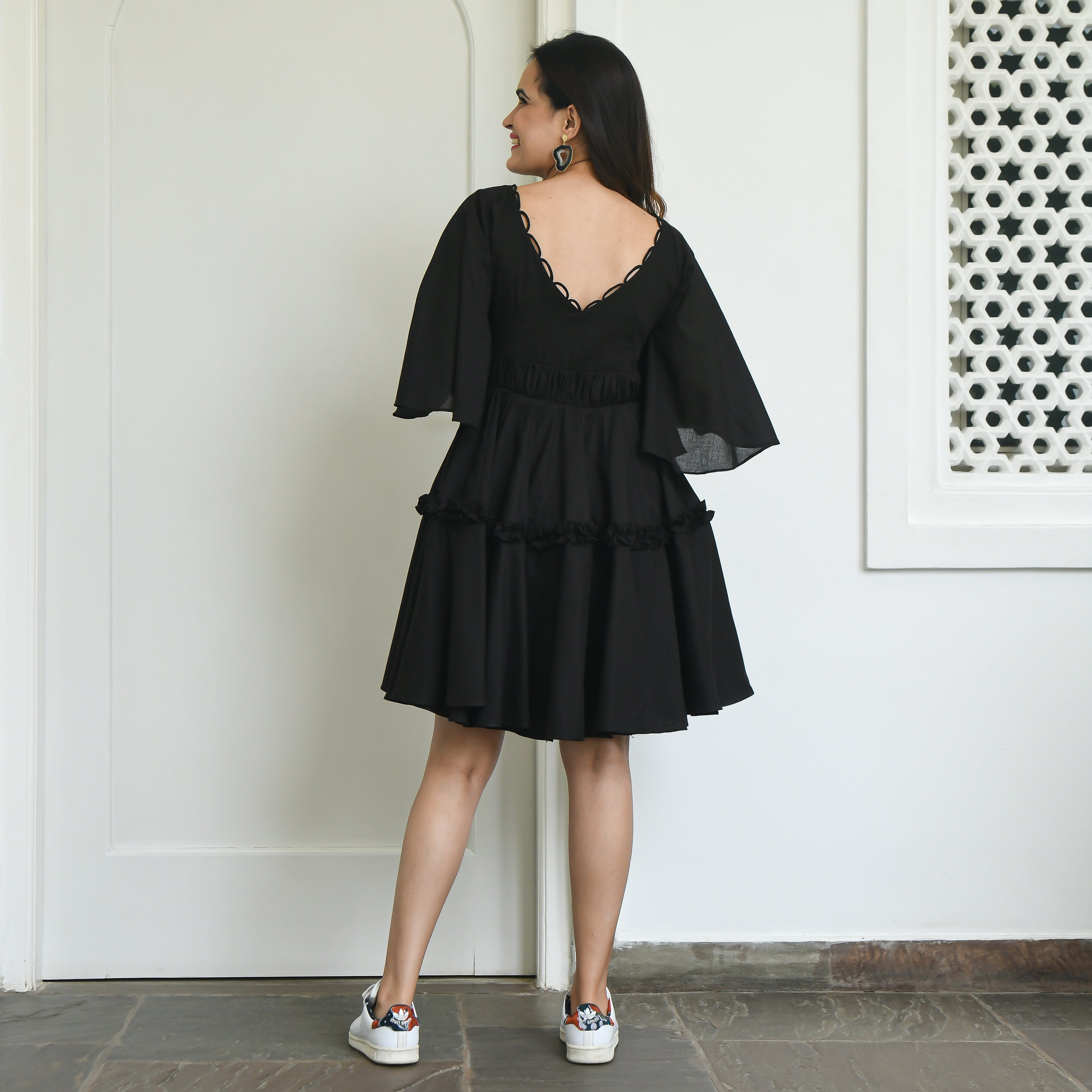 Black pleated and flared dress.